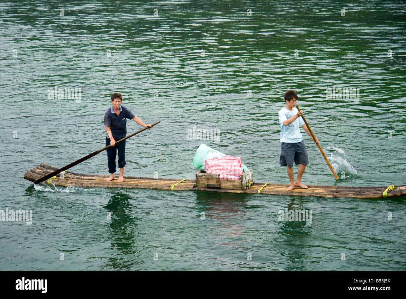 Chinese men on a bamboo raft selling goods, Li River, China Stock Photo ...