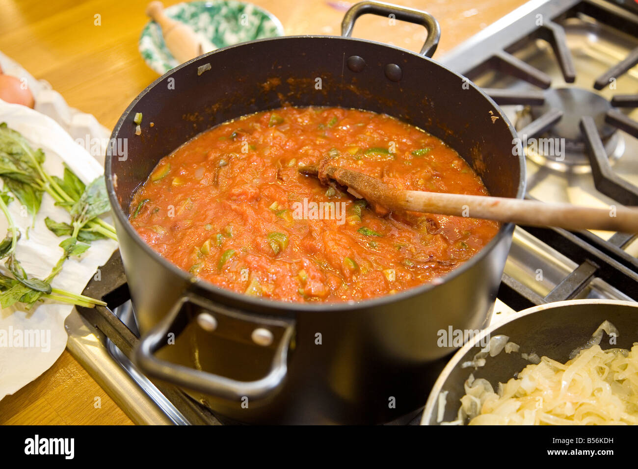 Pasta sauce cooking on a stove Stock Photo Alamy