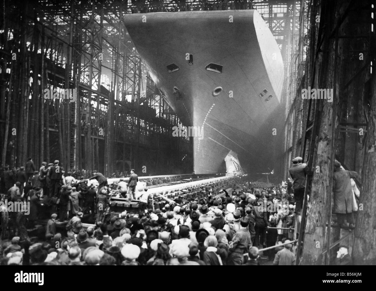 HMS Albion, Britain's newest aircraft carrier proceeding down the slipway at Wallsend on Tyne after being launched by the wife of the Prime Minister, Mrs. C.A. Attlee. ;The Albion will be towed across the river Tyne to Jarrow, where she will stay for nine months before work is started on her completion. ;May 1947 ;P009397 Stock Photo