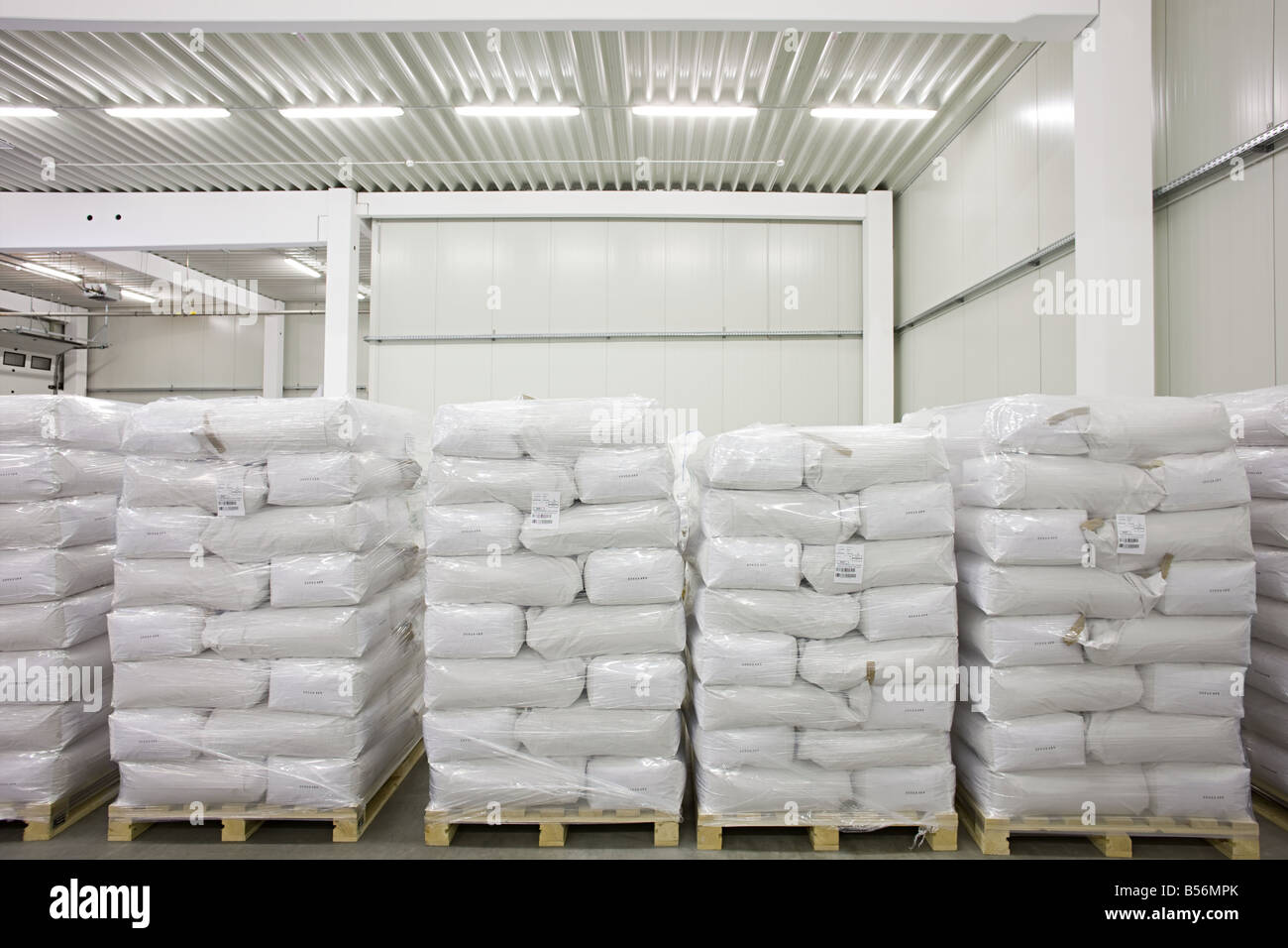Stock stacked in a warehouse Stock Photo Alamy