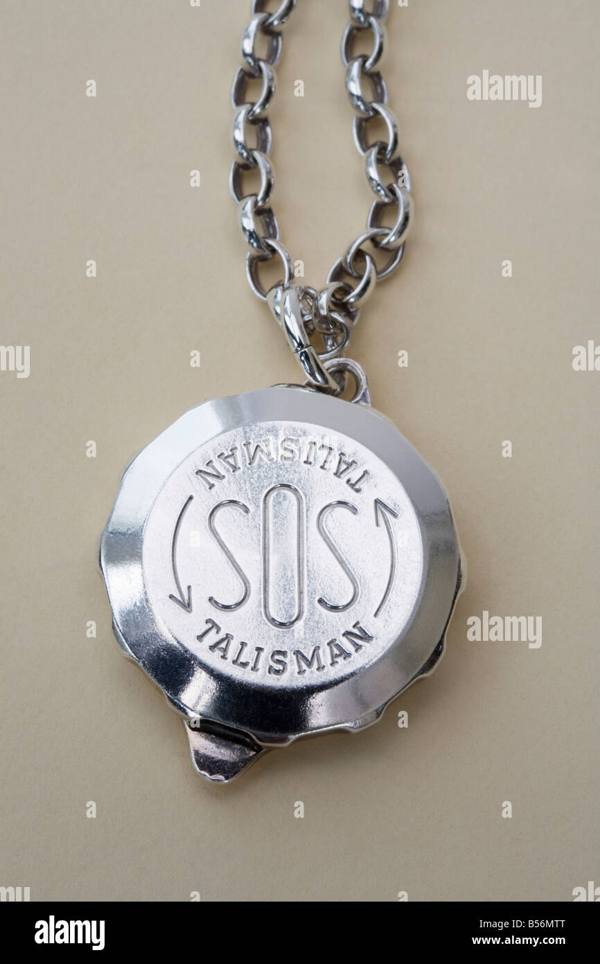 Studio still life SOS talisman silver pendant ID warning Stock Photo