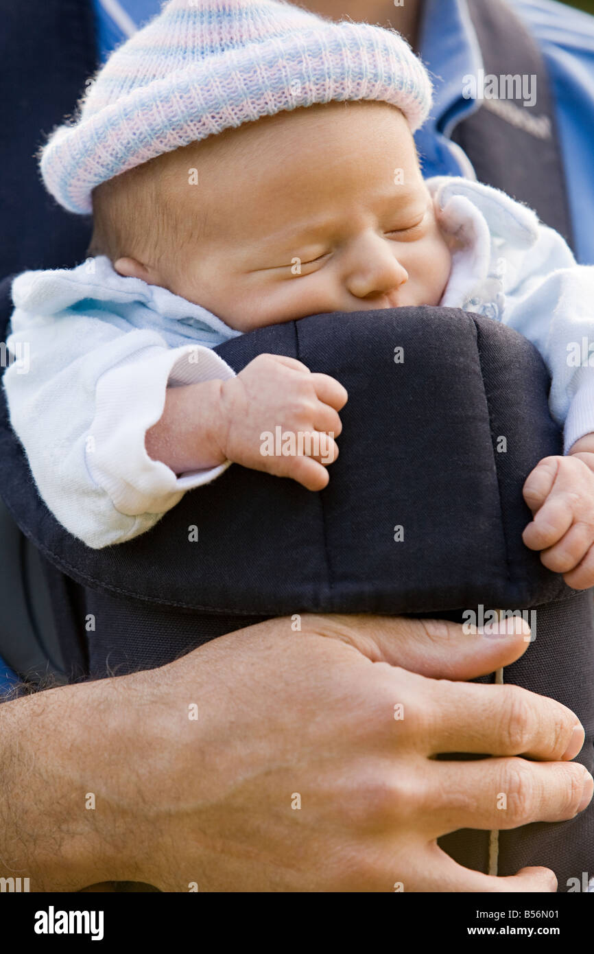 Father Carrying Child In Baby Carrier High Resolution Stock Photography