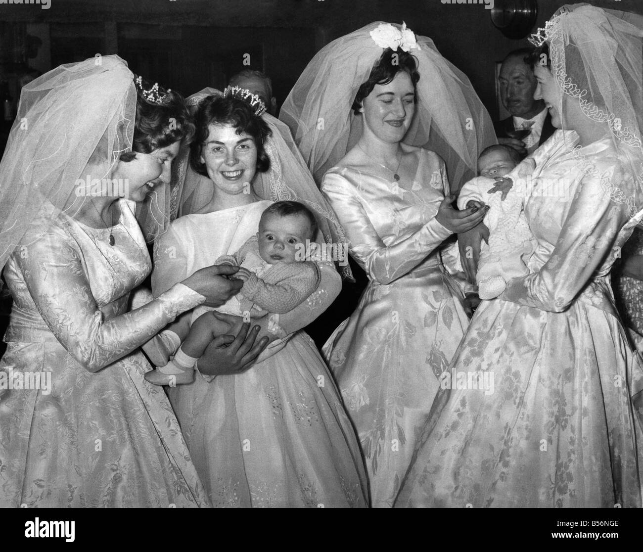 Marriage: Weddings. Mrs. Michael Stacey and Baby. Bogus vicar victims have 2nd wedding ceremony and christening for two of them. May 1961 P009961 Stock Photo