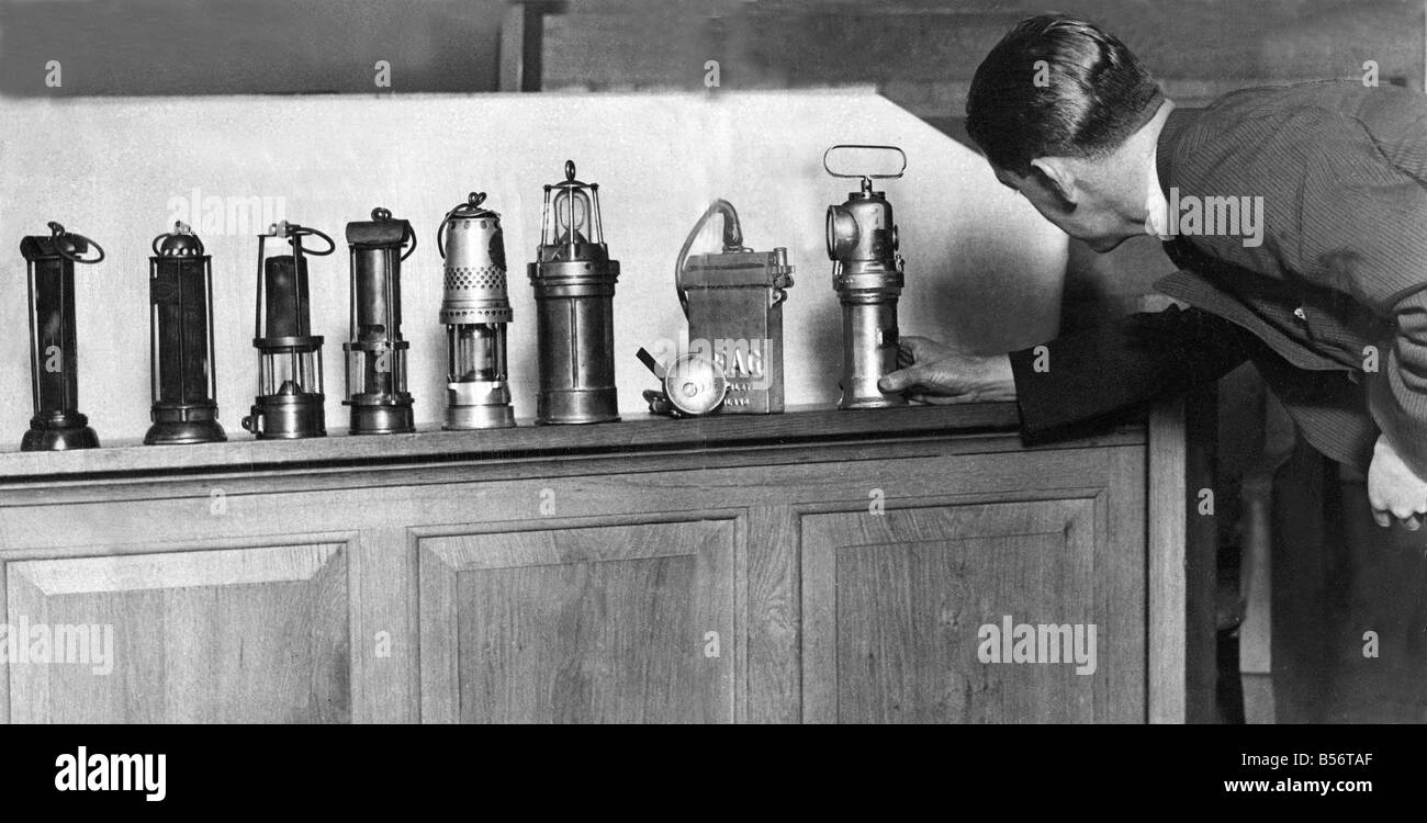 The wonderful array of miners lamps collected in Armstrong College Newcastle The earliest The Davy and Stephenson lamps are seen on the left and each lamp along the line shows an improvement with the most modern models on right Stock Photo