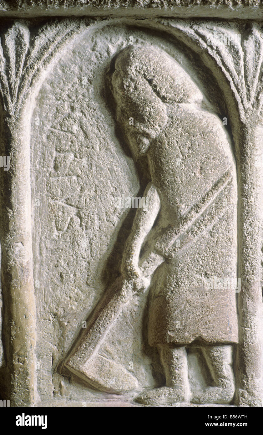 Burnham Deepdale Norman Font detail July scything Labour of the Month stone carving Romanesque art 12th century Norfolk England Stock Photo