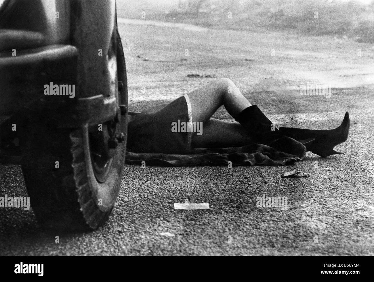 Woman car mechanic. No need to stop, chaps. Sue Gosling's managing quite well, thank you. January 1973 P010040 Stock Photo