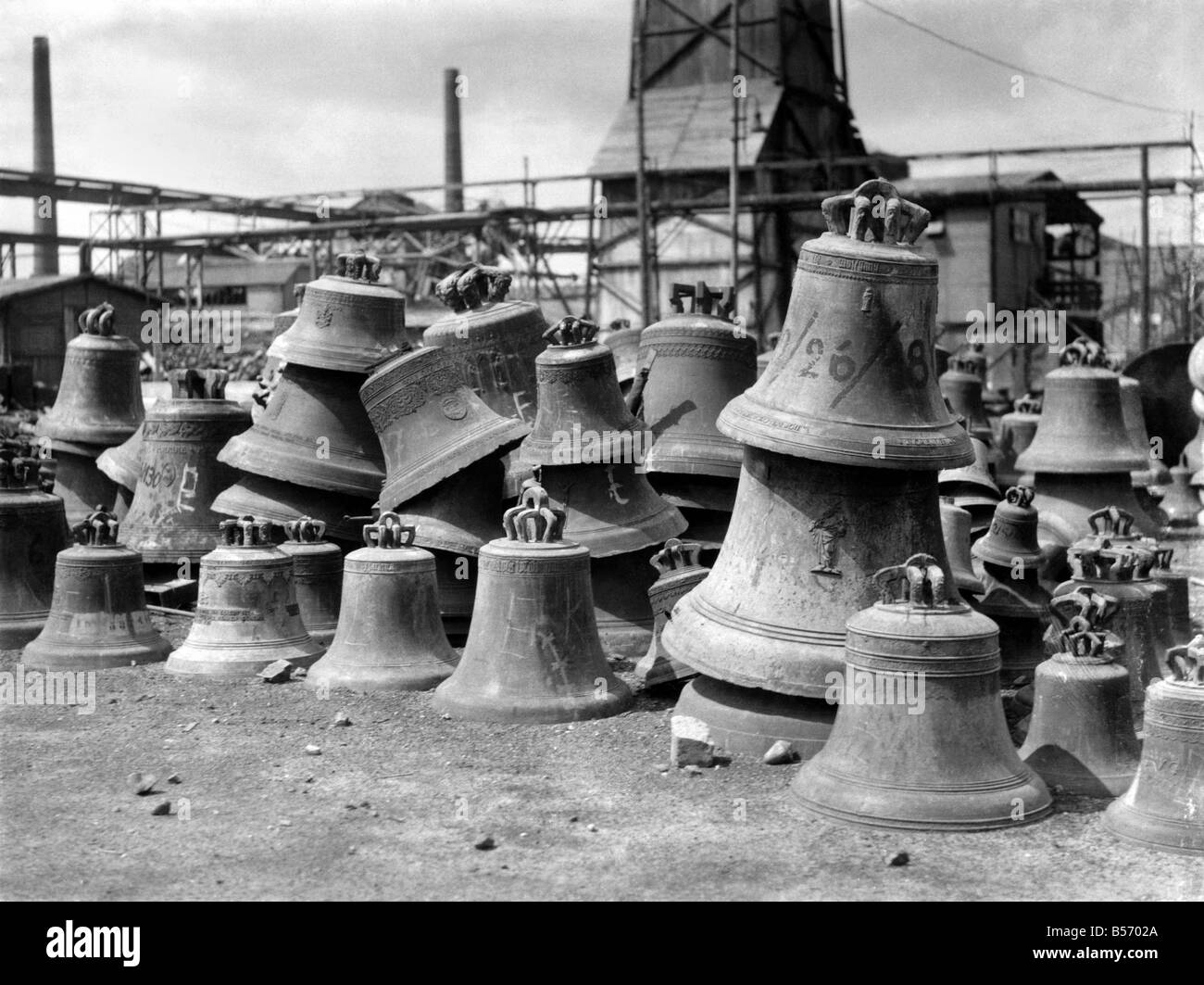 War salvage: Pictures taken in a German smelting yard at Hamburg which shows the shortage of German metal for Munitions. Here are Bronze statues and Church Bells collected from occupied countries piled in a heap ready for smelting irrespective of their value. The end of the war may save some of the more valuable ones. June 1945 P010152 Stock Photo