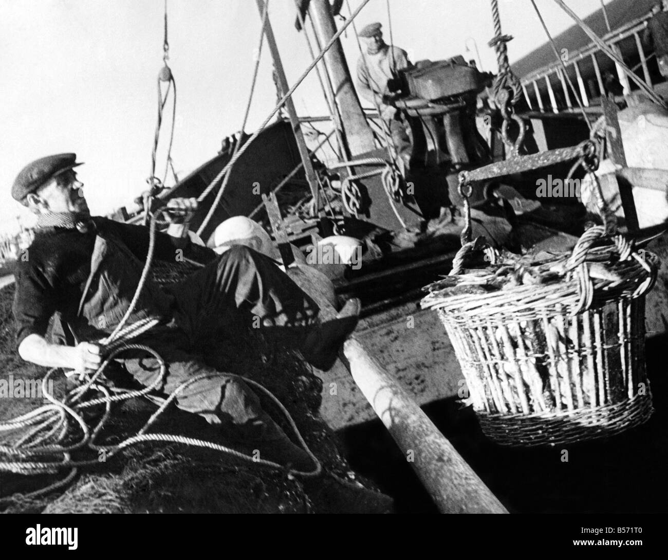 Scottish fisherman of 50 years Alec Gardiner gives a hand on the