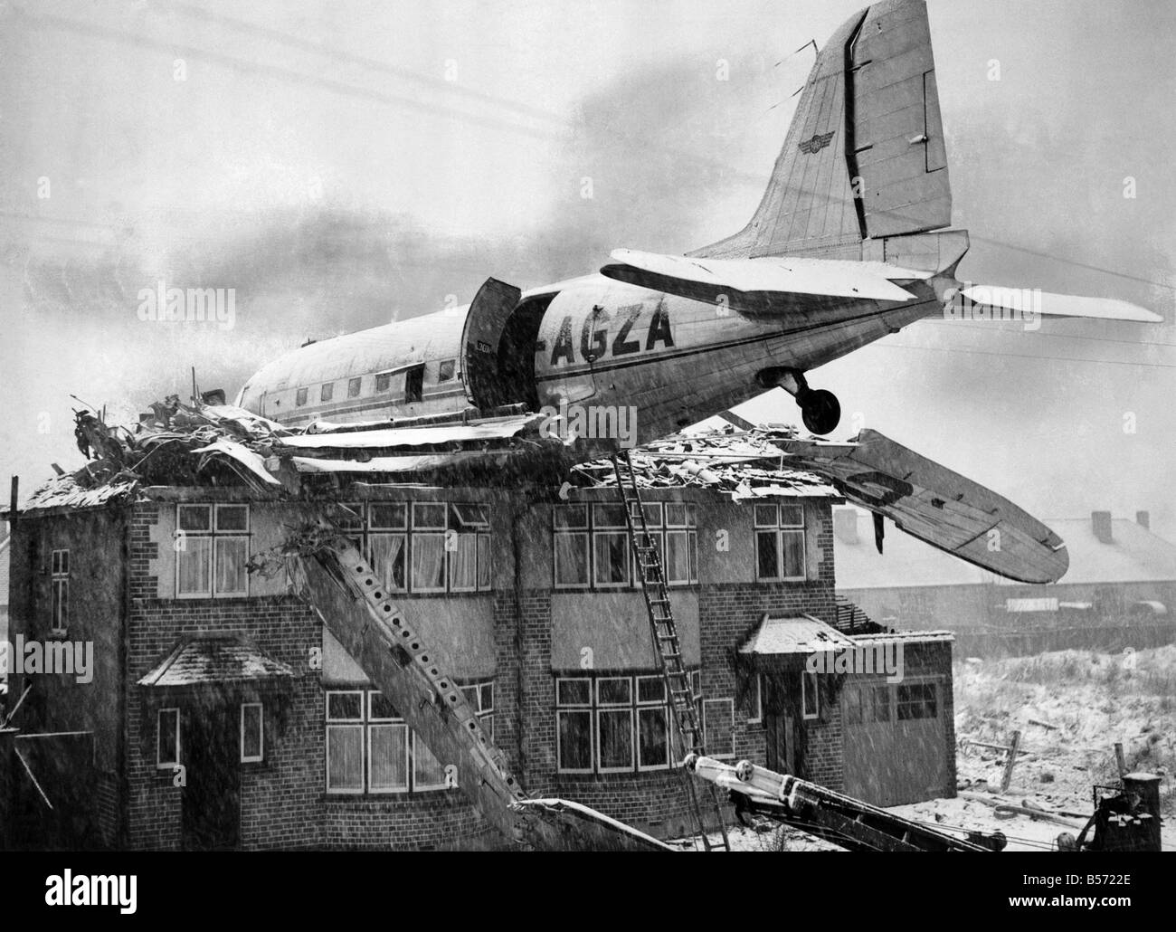 A Dakota air liner of Railway Air Services crashed into two houses in South Ruislip. No one was injured. December 1946 Stock Photo