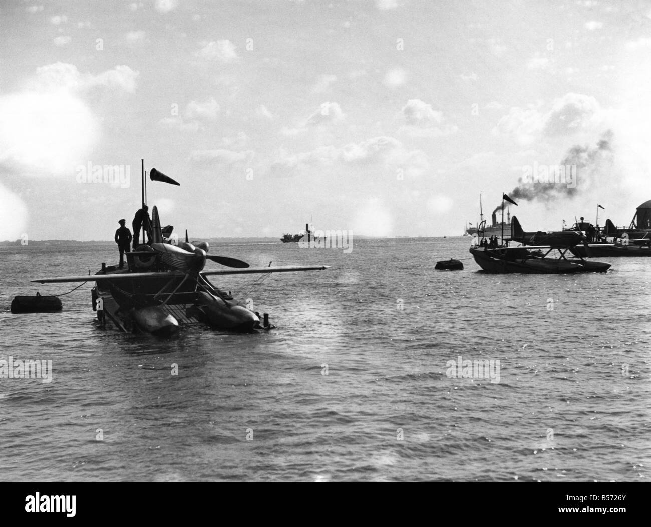 Schneider Trophy Race held at C, ;A Supermarine SB6 plane is towed back to the shore on the Solent after the race. ;Sept. 1931 ; Stock Photo