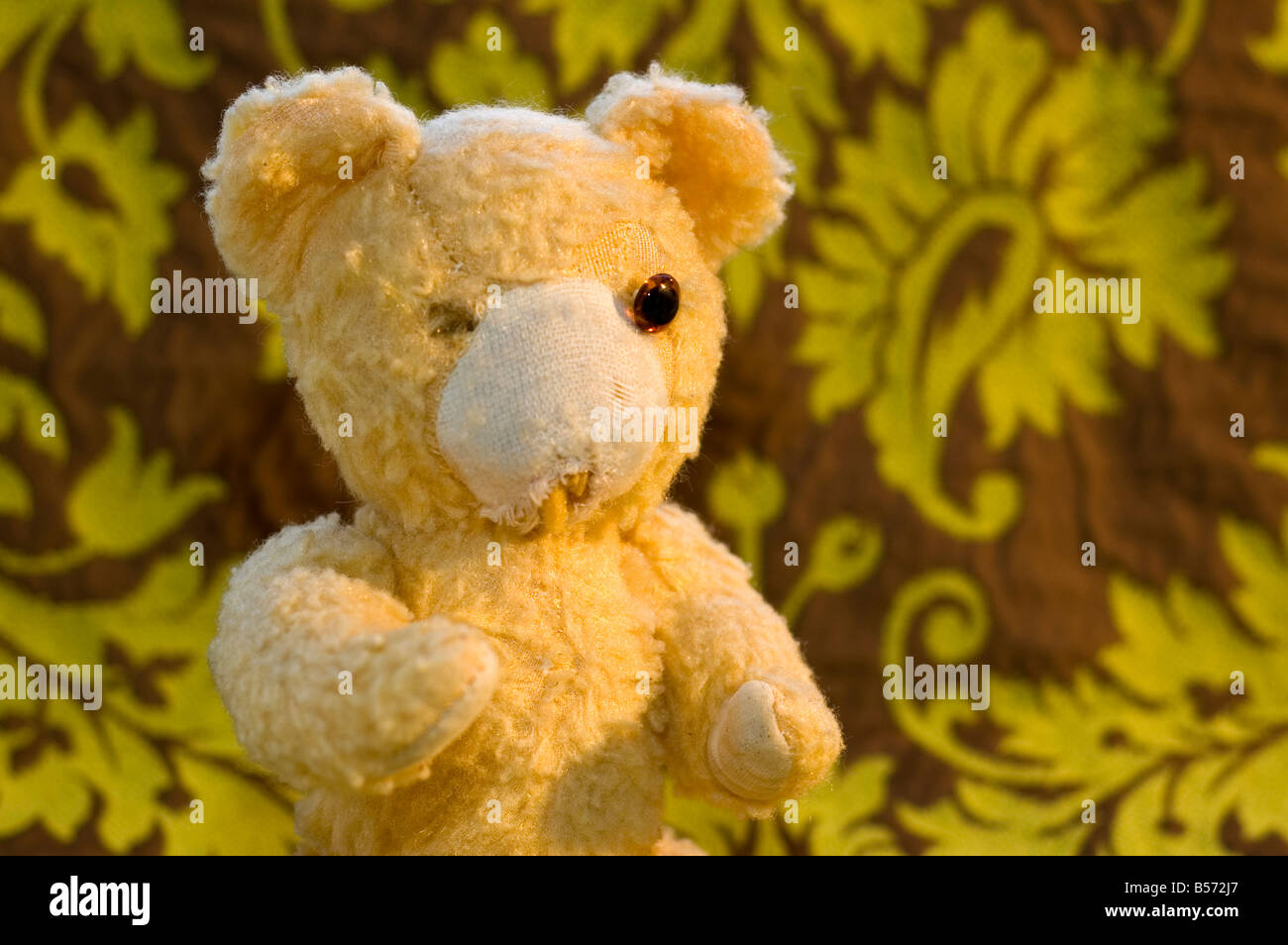 an old teddy bear on a classic background Stock Photo - Alamy