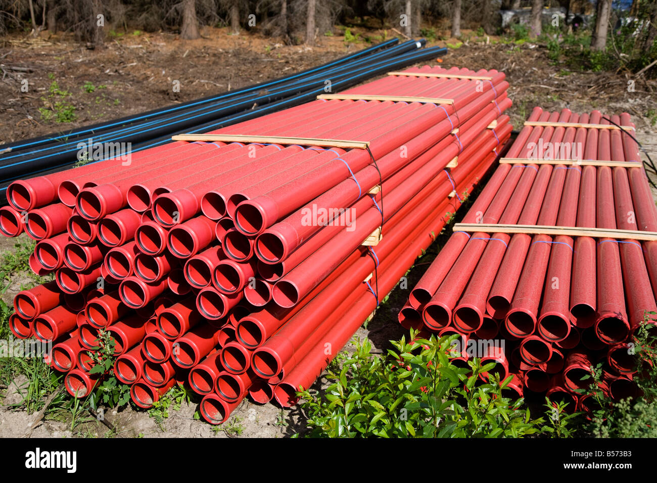 Piles of red drainage pipes , Finland Stock Photo