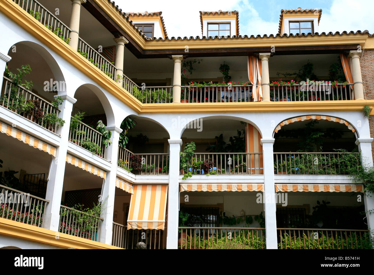 Apartments in Cordoba with green balconies and Moorish influenced architecture Stock Photo