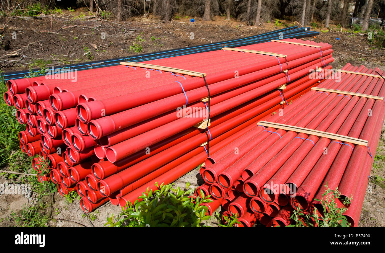 Pile of red drainage pipes , Finland Stock Photo