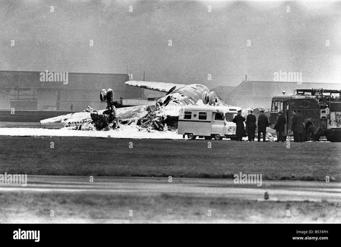 Accidents - Air: Hostess Jane lives as plane dives to disaster: An air hostess staggered into the arms of rescuers on Thursday (20-3-69) after walking out of the blazing wreckage of an airliner. She was the sole survivor of the plane's crew of four. The airliner, a Viscount belonging to British Midland Airways, Plunged into a runway at Manchester Airport, Lancashire, seconds after taking off on a routine training flight. One of the rescuers said that the hostess, Jane Timson, "walked towards us as we raced up the runway, and didn't appear badly hurt." March 1969 P04402 Stock Photo