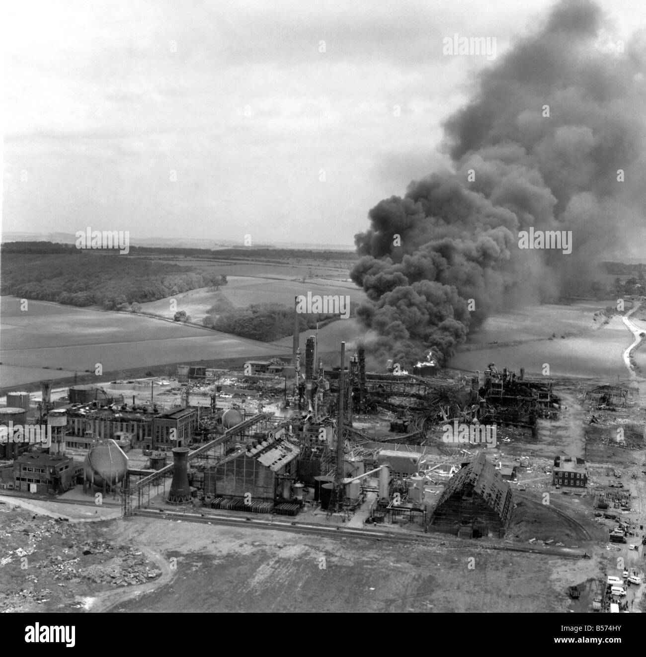 Disaster Blast At Flixborough A massive blast ripped apart an entire village late on Saturday afternoon, 1st June 1974. At least 29 people died and 100 houses were wrecked when an explosion shook the Nypro chemical plant at the Lincolnshire village of Flixborough. 3,000 people were evacuated as firemen tried to prevent an escape of poisonous gas from ammonia tanks, seven miles away in Scunthorpe flying glass caused injuries and homes shook thirty miles away. The scene of devastation at Nypro works, Flixborough. June 1974 P004444 Stock Photo