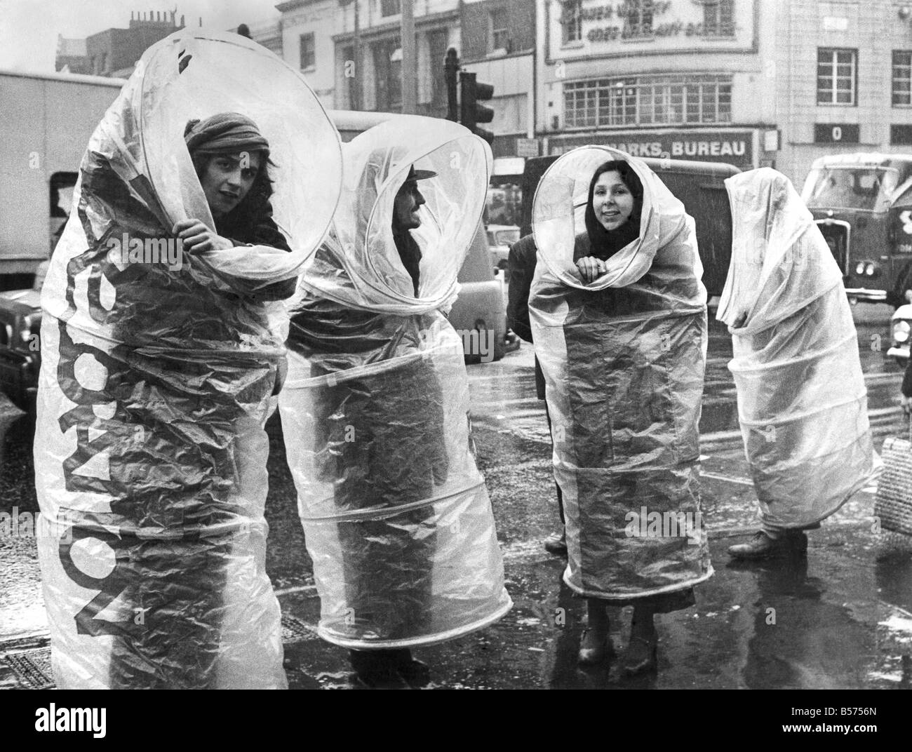 Clothing. Rainwear. Four rain shells. Exhibiting them: artists from a group called Transmedia Explorations. The group, who work Stock Photo