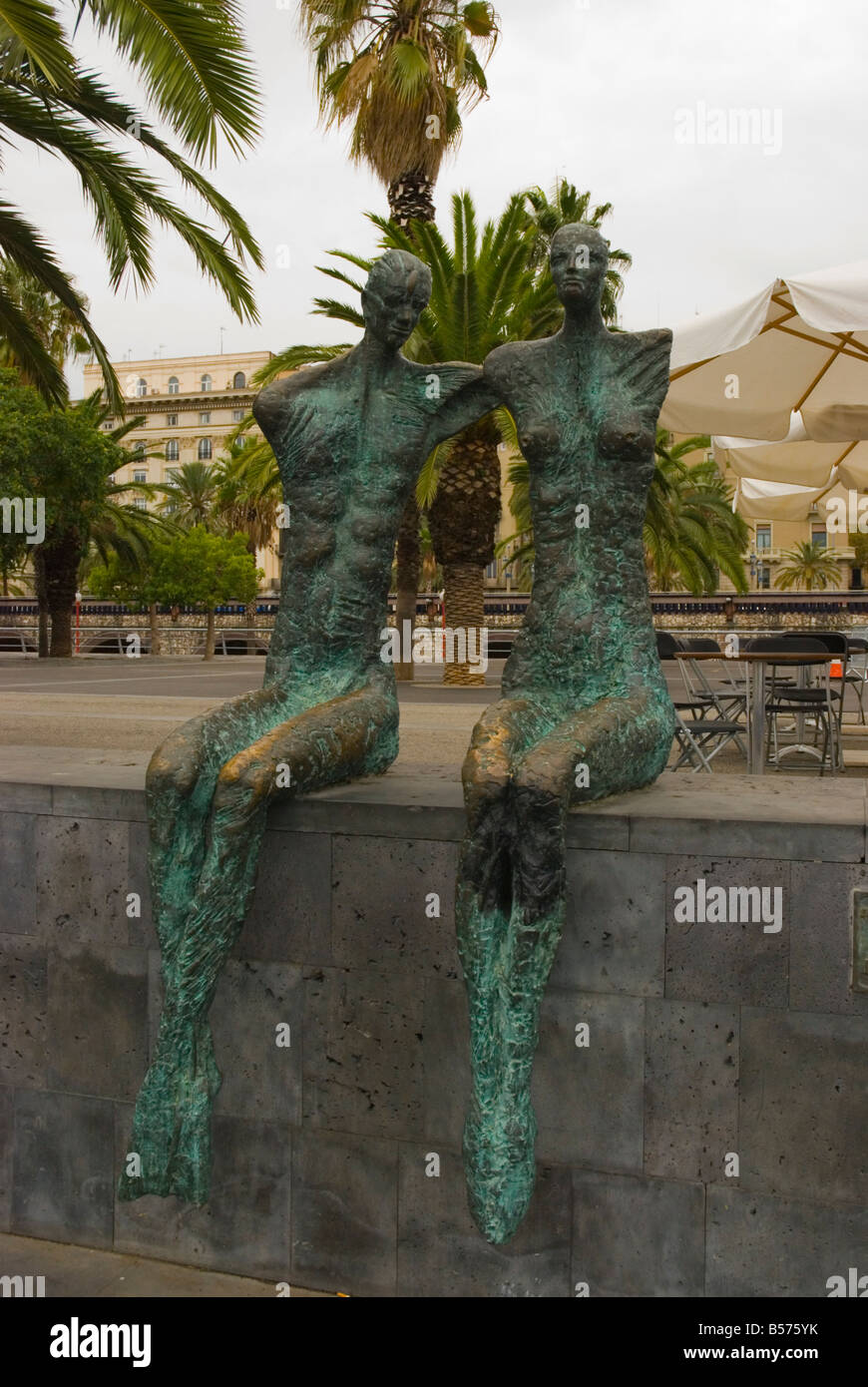 Statue of two women in Port Vell in Barcelona Spain Europe Stock Photo