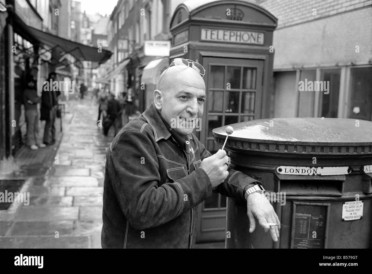 Actor: Telly Savalas (Kojack the Brooklyn cop on T.V.) is in London for a few days to film scenes in a Warner Brothers film called 'Inside Out'. February 1975 75-00927-008 Stock Photo