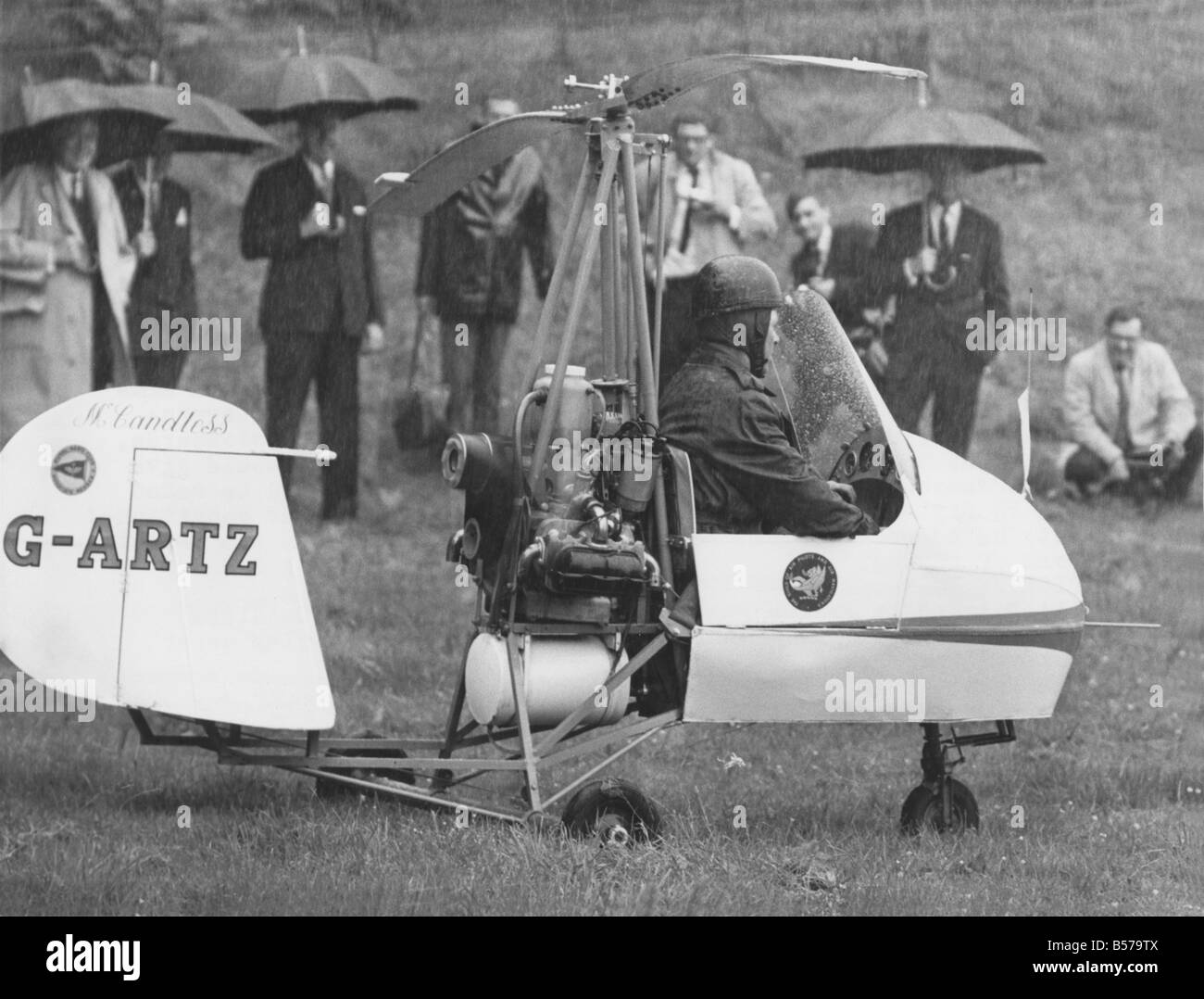 Watched by Prince Philip, autogyro pilot Rex McCandless begins his take-off in a field But his flying display never got off the Stock Photo
