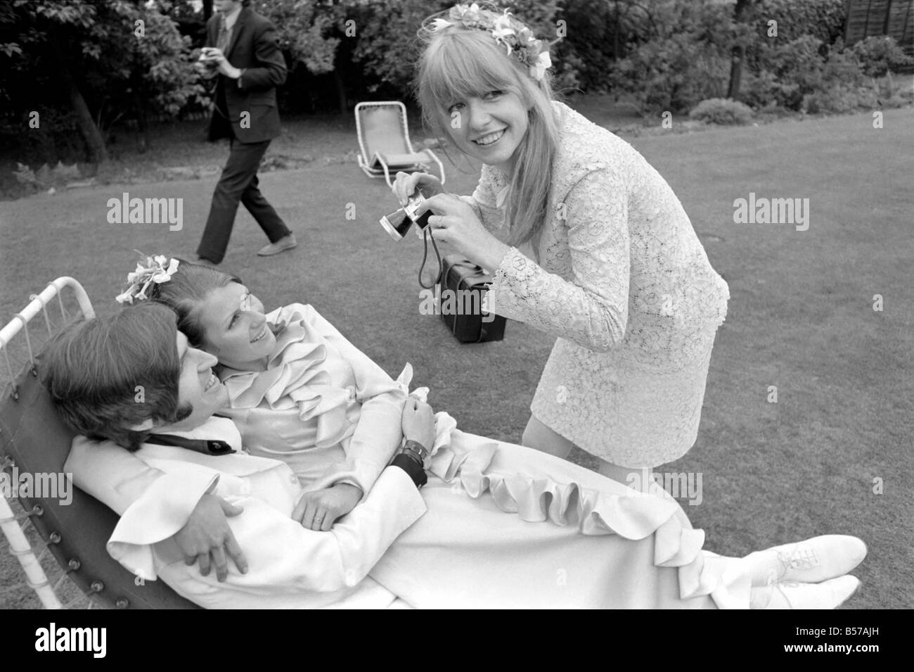 Mike McCartney's Wedding. Jane Asher takes a photograph of the bride and groom Mike McGear and Angela Fishwick. June 1968 Stock Photo