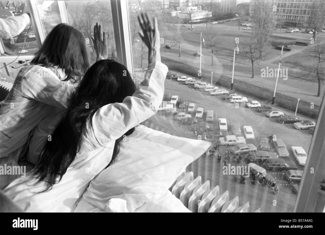 John Lennon and his wife Yoko Ono are having a weeks lovein their room at the Hilton Hotel John Lennon and his wife Yoko Ono are having a weeks lovein their room at the Hilton Hotel