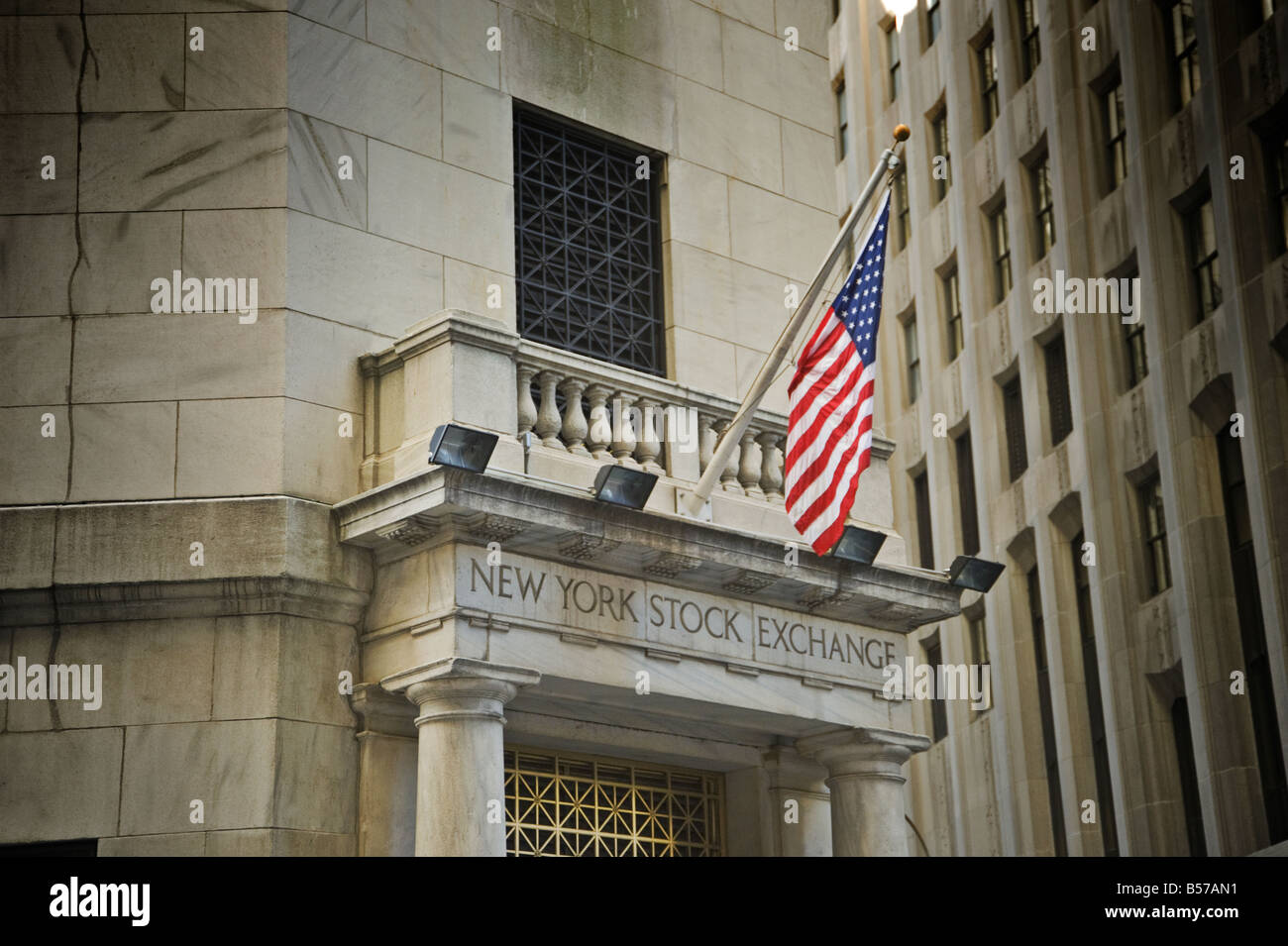 Stars & Stripes flies over a side entrance to the New York Stock Exchange Stock Photo
