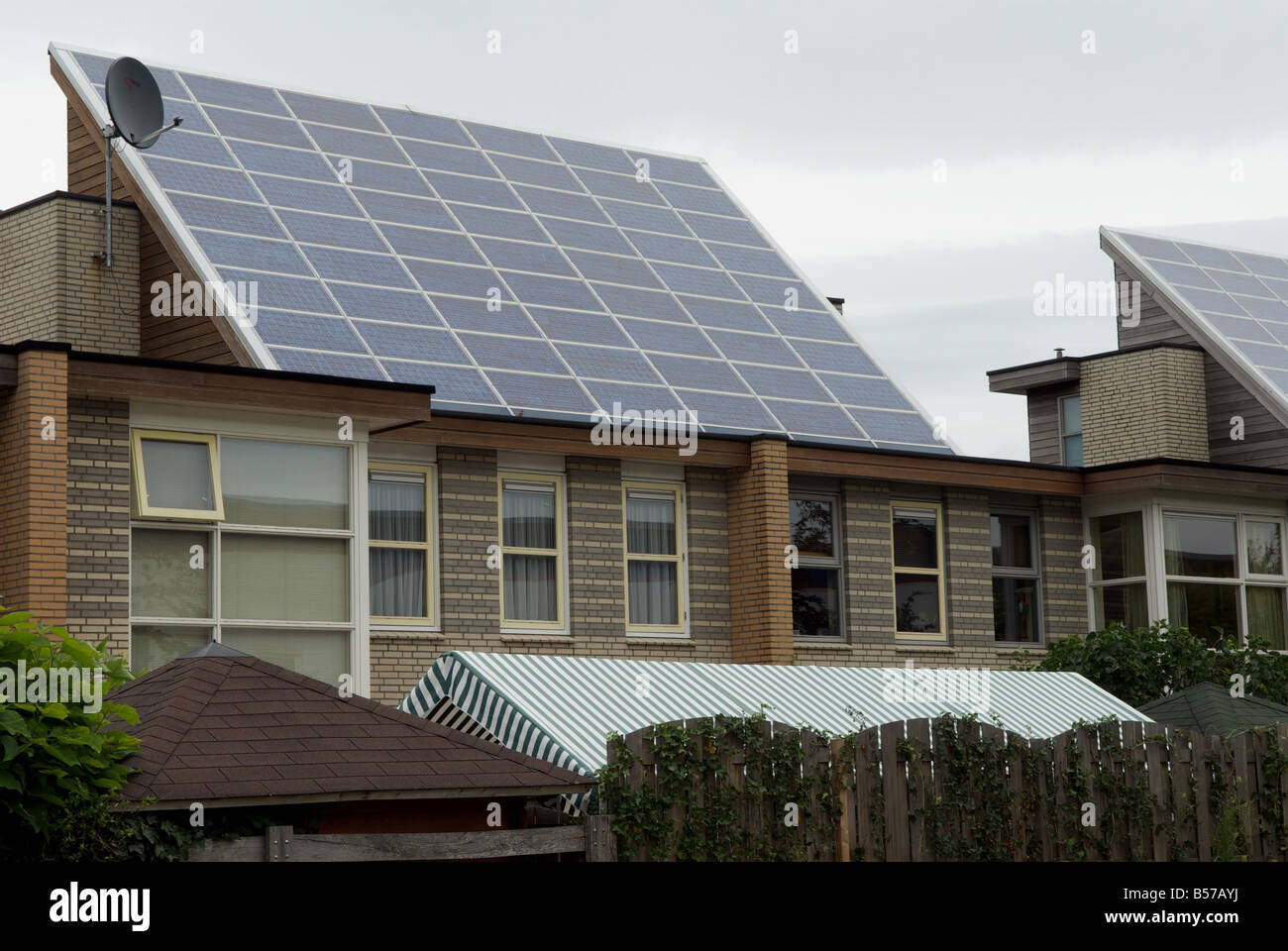 Shell solar panels fitted to houses on the world's largest solar powered housing estate, Nieuwland, Amersfoort, Netherlands. Stock Photo