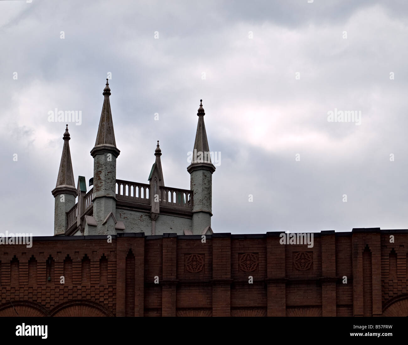 brick buildings with a dramatic cloudy sky Stock Photo - Alamy