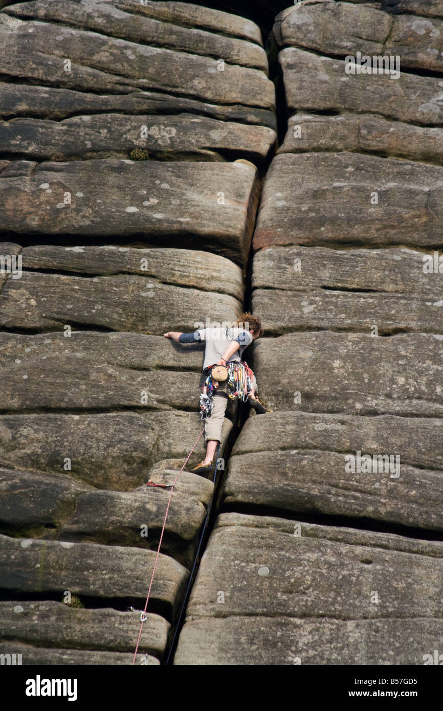 Climber climbing crack in rock Stock Photo Alamy