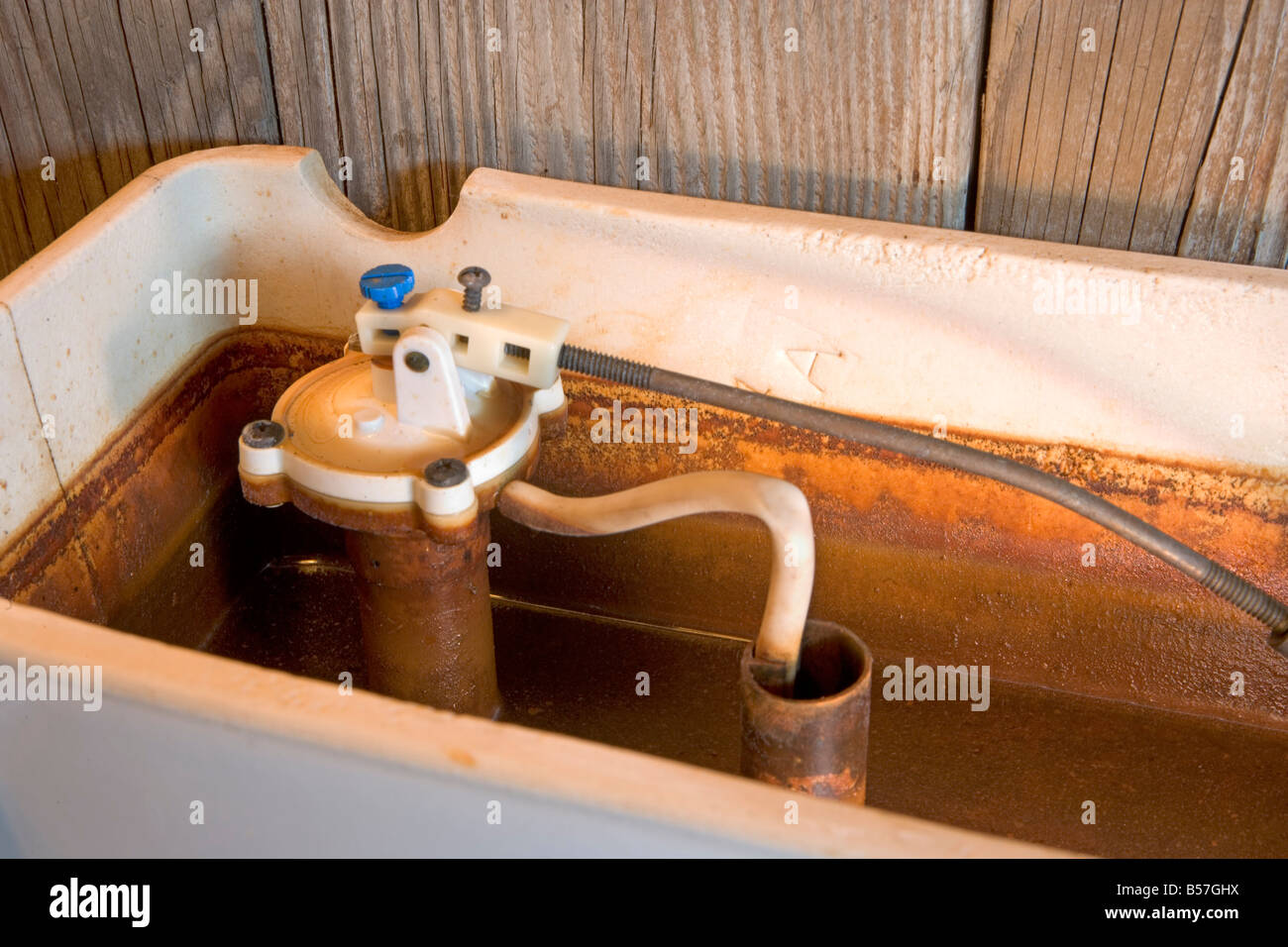 Water with high iron content leaves rust stains behind in places like toilet  tanks This one is an extreme example Stock Photo - Alamy