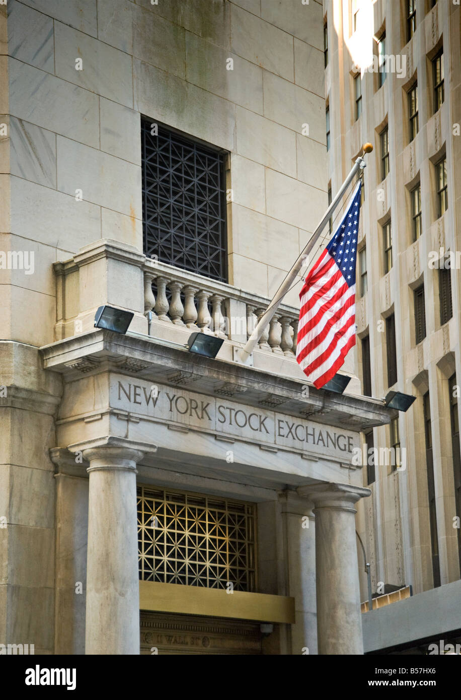 Stars & Stripes flies over a side entrance to the New York Stock Exchange Stock Photo