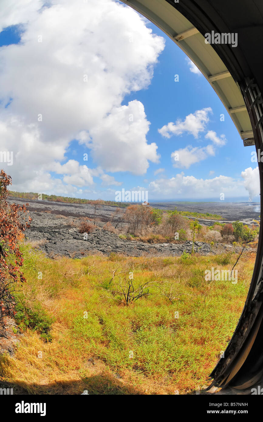 View of active lava flows and the Waikupanaha ocean entry from abandoned house in the abandoned Royal Gardens subdivision Stock Photo