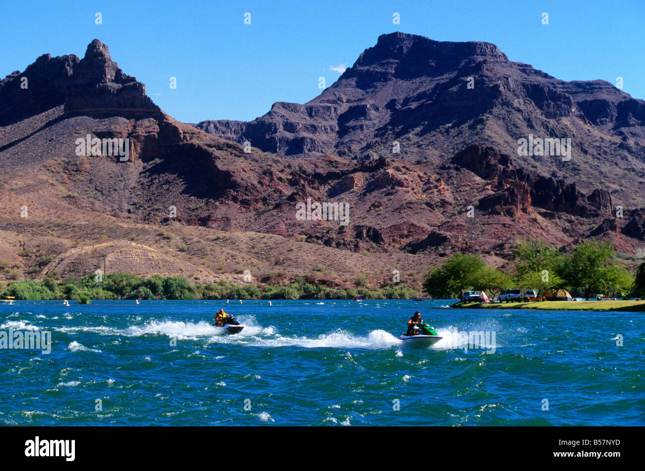 Jetski riders speed along the Colorado River at Lake Havasu, Arizona