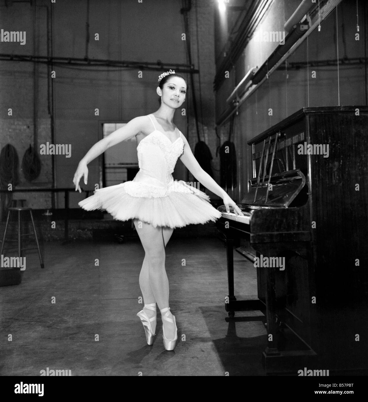 Japanese Ballet Dancer: Noriko Ohara. Four feet ten inches tall, and weighing under seven stone this girl has come a long way to join the world of ballerinas in London. She is petite Norikpo Ohara of the Japanese balet who is rehearsing in London to take the leading role in Coppelia with the London Festival Ballet in London later in the month. January 1975 75-01174-003 Stock Photo