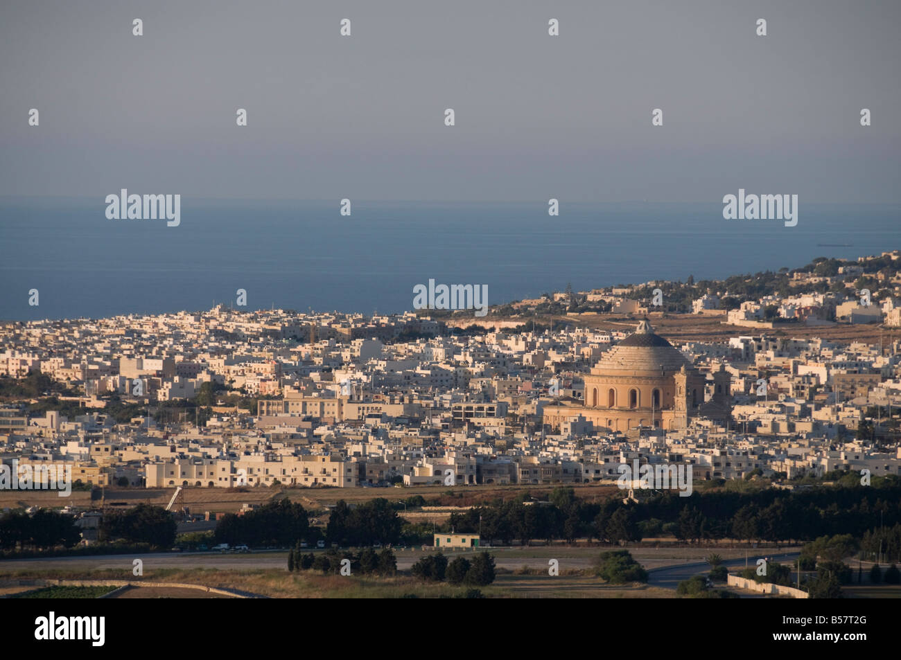 The dome of Mosta in distance viewed from Mdina the fortress city, Malta, Europe Stock Photo