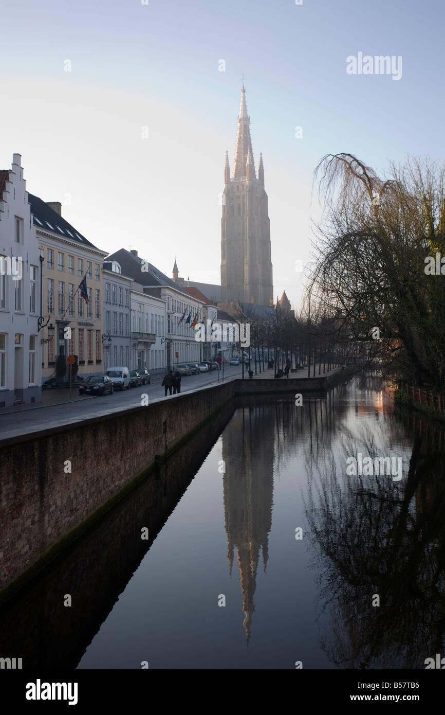 Looking south west along Dijver, towards The Church of Our Lady (Onze Lieve Vrouwekerk), Bruges, Belgium, Europe Stock Photo