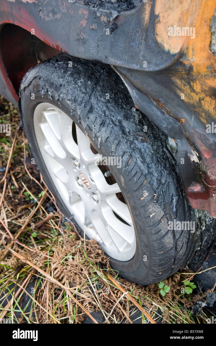 Melted car tyre on burned out dumped vehicle Wales UK Stock Photo Alamy