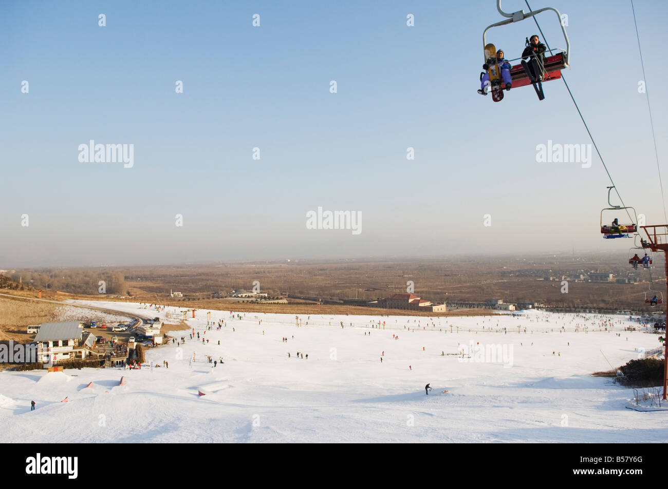 A ski lift taking skiers up to the slopes at Shijinglong ski resort, Beijing, China, Asia Stock Photo