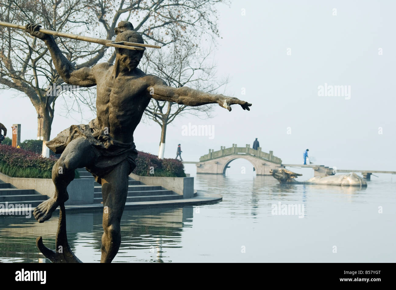 Statue of a spear fisherman in the waters of West Lake, Hangzhou