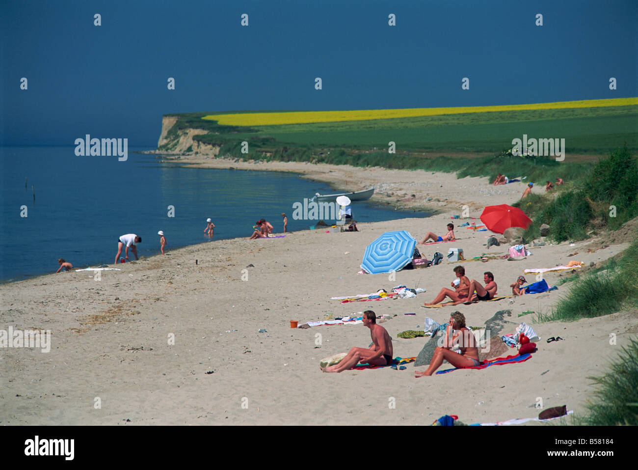 Families relaxing on the beach near St. Rise, Aero Island, Denmark