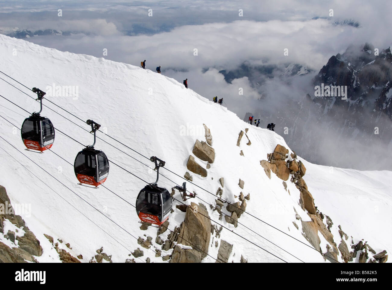 Cable cars approaching Aiguille du Midi summit, ChamonixMontBlanc, French Alps, France, Europe