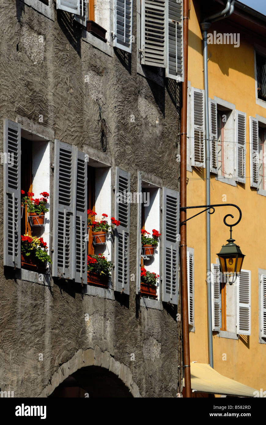 Flower bedecked shuttered windows, Rue Sainte-Claire, Annecy, Rhone Alpes, France, Europe Stock Photo