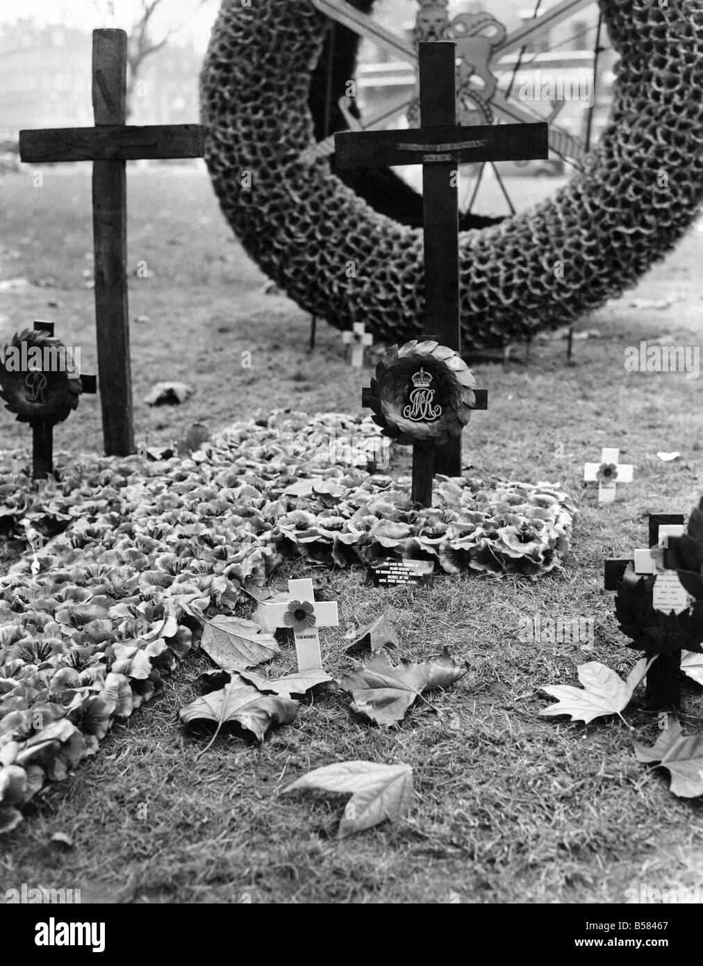 Many People visited the empire field of remembrance in St. Margaret's Churchyard, Westminster, To-day to plant a poppy in memory of someone dear to them. Pic 7-11-53. The cross planted in memory of the Late Queen Mary, By Major General Sir Richard Howard-Vyse, K.C.N.G., D.S.O. colonel of the Royal Horse guards. November 1953 P005404 Stock Photo