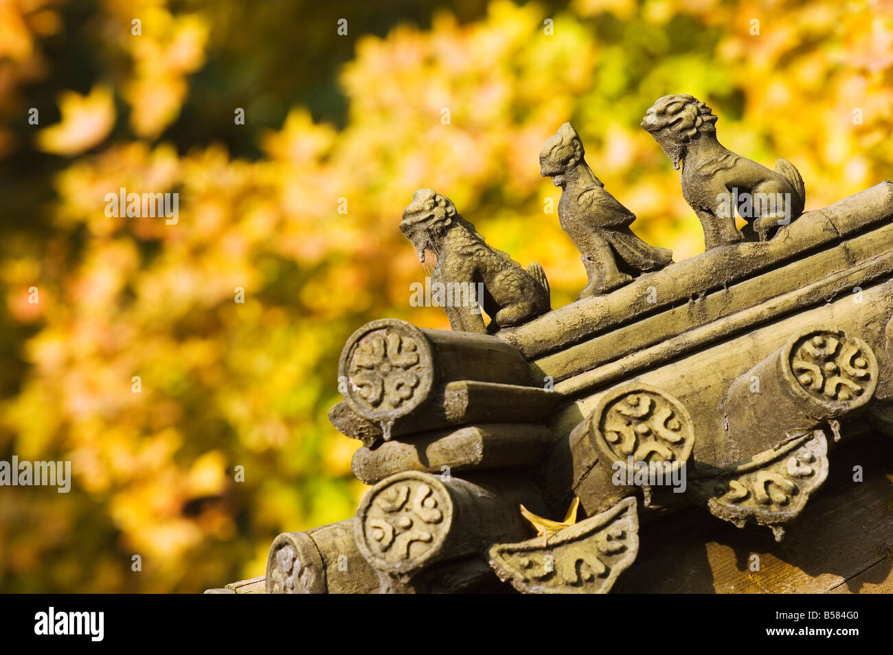 Autumn colours and ornamental Chinese style decorative figures on a