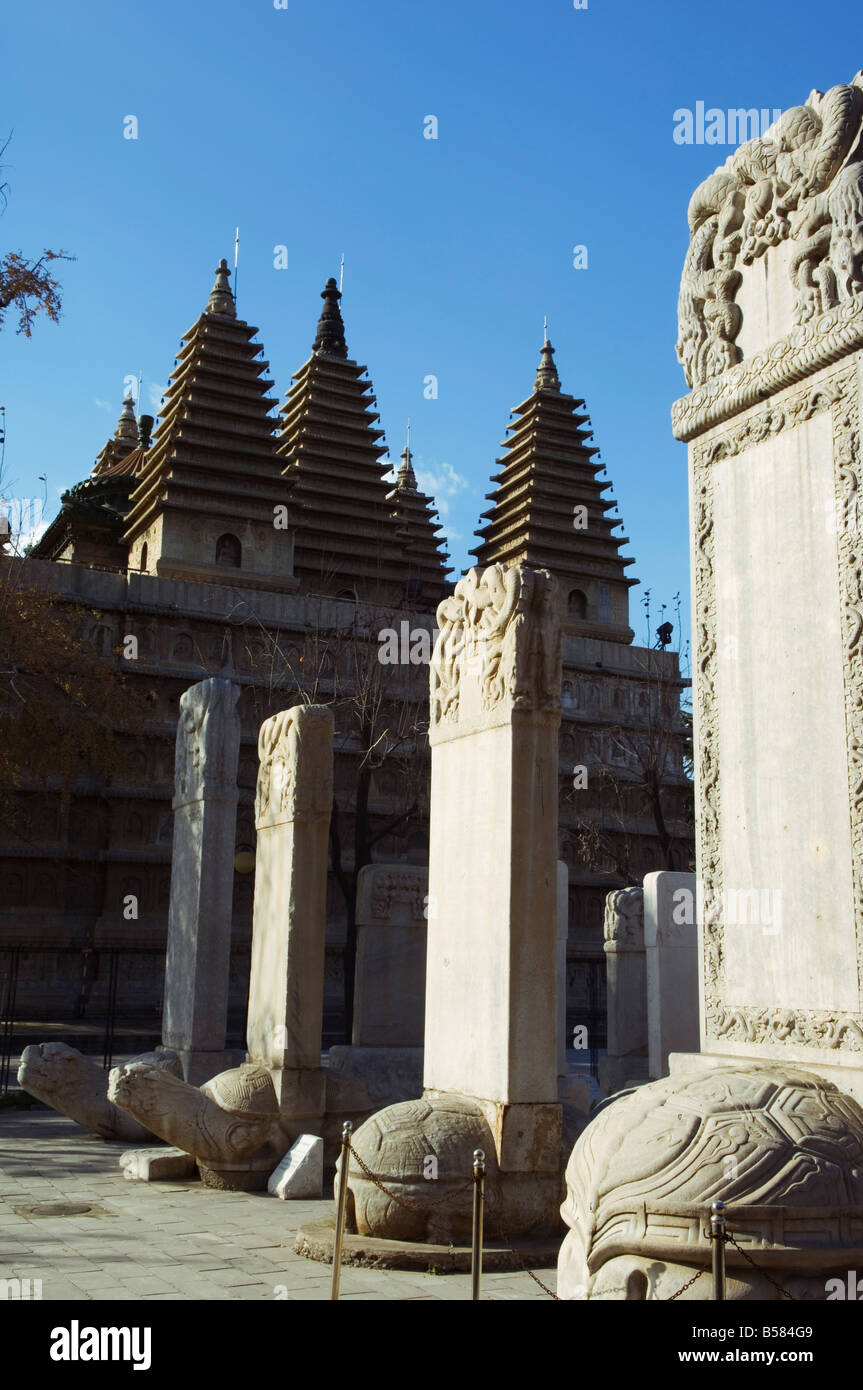 A five towered temple and Ancestral tombs inscribed with dead persons contributions life and honours at Zhen Jue temple, Beijing Stock Photo