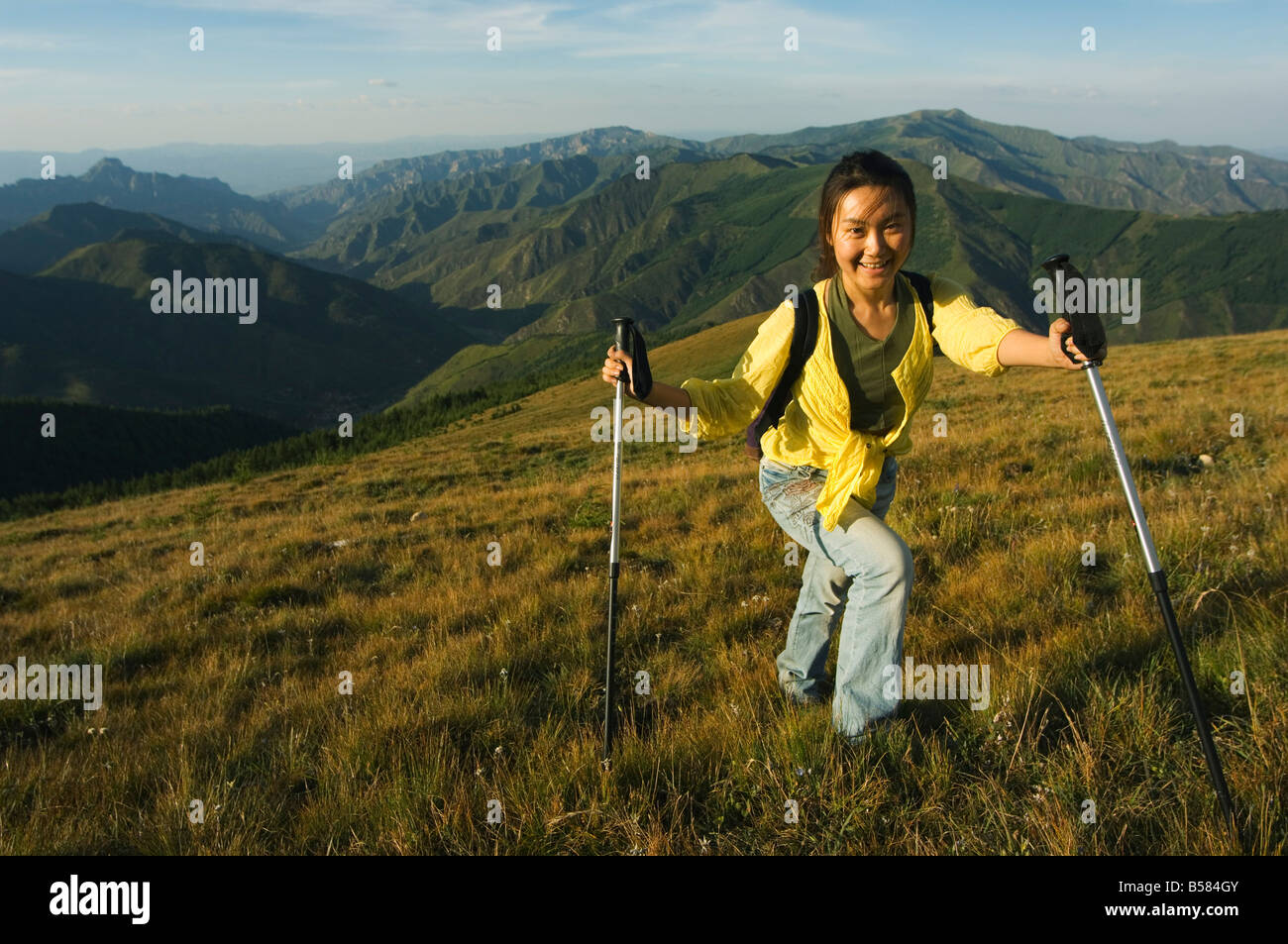 Mountain scenery and Chinese female hiker at Wutaishan one of China's sacred Buddhist mountain ranges, Shanxi province, China Stock Photo