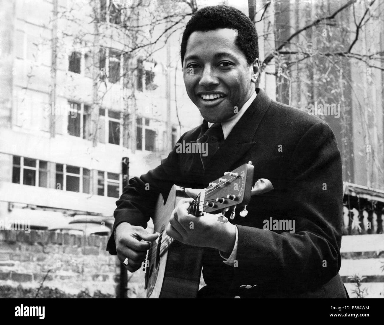 Labi Siffre with his guitar in a City Garden. May 1970 P005510 Stock