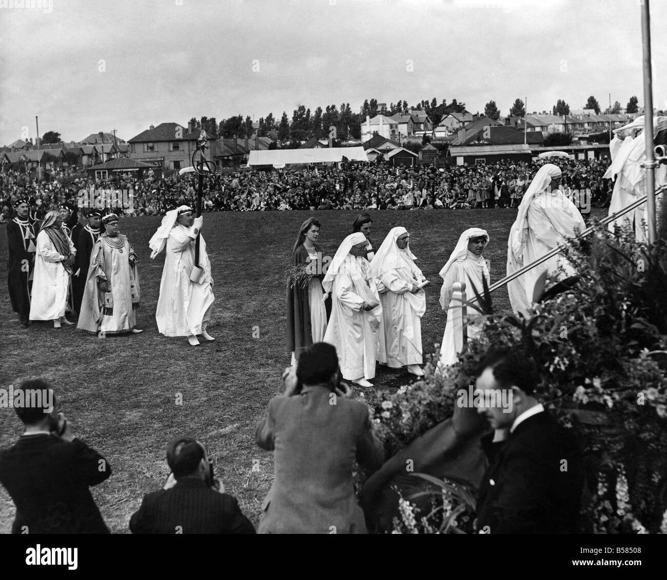 Royal Visit to North Wales: The Bardic procession enters the National Eisteddfod Pavilion to await H.M. The Queen. Behind the Sword Bearer on the left is Cynin The Arch Druid. July 1953 P005524 Stock Photo