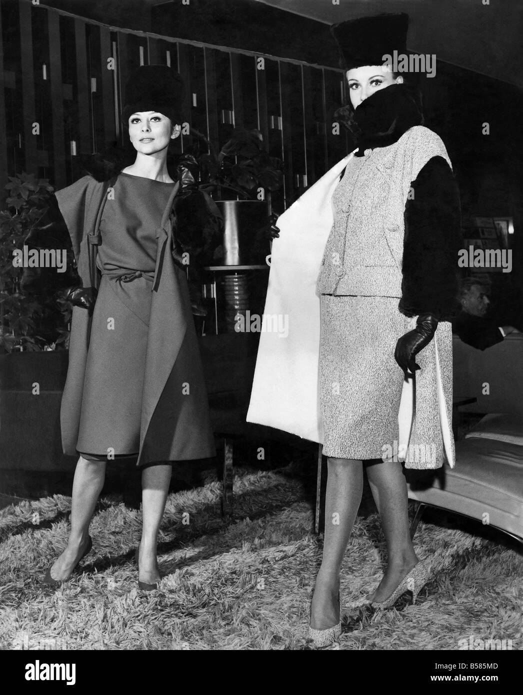 Clothing Misc. 1963: Alaskan seal fur hat, collar and suit sleeves. Toped with sleeveless coat in matching tweed. Designed by Trevira Studio. November 1963 P006790 Stock Photo